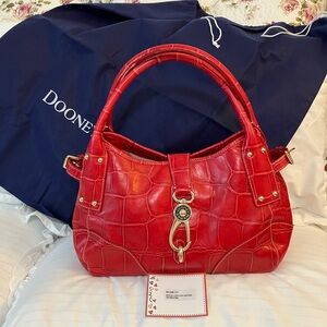 Dooney & Bourke Vintage Crocodile embossed logo lock satchel.